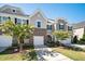 Charming townhome featuring stone accents, a driveway and well-manicured lawn at 835 New Derby Ln, Apex, NC 27523