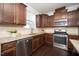 Well-equipped kitchen with stainless steel appliances and granite countertops at 835 New Derby Ln, Apex, NC 27523