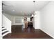Open-concept living room with hardwood floors, stairs and lots of natural light at 835 New Derby Ln, Apex, NC 27523