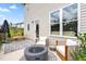 Outdoor back patio with comfortable seating area and a modern fire pit feature at 84 Elliot Dr Dr, Clayton, NC 27520