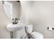 This bathroom has a toilet and a stylish white sink with black faucet at 84 Elliot Dr Dr, Clayton, NC 27520