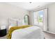 Bright bedroom with a comfortable bed, soft natural light, and peaceful outdoor view at 84 Elliot Dr Dr, Clayton, NC 27520