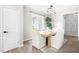 An inviting dining room with modern chandelier, wooden table and a plant that brings life and color to the house at 84 Elliot Dr Dr, Clayton, NC 27520