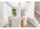 Cozy dining area with a light wood table, comfortable chairs, and a decorative plant at 84 Elliot Dr Dr, Clayton, NC 27520