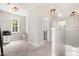 Hallway space with natural light and neutral color scheme, leading to other areas of the home at 84 Elliot Dr Dr, Clayton, NC 27520