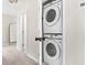 Convenient laundry area featuring a stacked washer and dryer for space-saving efficiency at 84 Elliot Dr Dr, Clayton, NC 27520