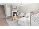 Inviting living room with a fireplace, white furniture, and a view of the staircase at 84 Elliot Dr Dr, Clayton, NC 27520