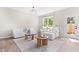 Bright living room with comfortable white seating, stylish decor, and natural light at 84 Elliot Dr Dr, Clayton, NC 27520