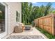 Cozy patio area with stylish outdoor furniture, a modern fire pit, and a privacy fence at 84 Elliot Dr Dr, Clayton, NC 27520