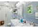 Beautiful bathroom with double vanity, marble countertops, and a glass-enclosed shower for a spa-like experience at 1 Saturn Court Ct, Durham, NC 27703