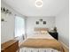 Well-lit bedroom with carpet, tan walls, and decor, creating a cozy and inviting atmosphere at 1 Saturn Court Ct, Durham, NC 27703