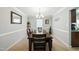Formal dining room with chandelier lighting and space for large gatherings at 1 Saturn Court Ct, Durham, NC 27703