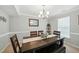 Cozy dining room featuring a wooden table with bench seating and stylish decor at 1 Saturn Court Ct, Durham, NC 27703