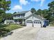 Traditional two-story home with a spacious driveway and attached two-car garage at 1 Saturn Court Ct, Durham, NC 27703
