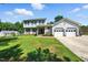 Charming two-story home with attached two-car garage and well-manicured lawn at 1 Saturn Court Ct, Durham, NC 27703