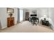 Neutral living room with carpet flooring and vintage cabinet at 1 Saturn Court Ct, Durham, NC 27703