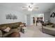 Spacious living room featuring comfortable seating, a ceiling fan, and an open layout at 1 Saturn Court Ct, Durham, NC 27703