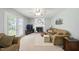Inviting living room with a fireplace, comfortable seating, and ample natural light at 1 Saturn Court Ct, Durham, NC 27703