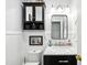 Elegant powder room featuring a marble countertop vanity and stylish fixtures, perfect for guests at 1 Saturn Court Ct, Durham, NC 27703