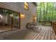 Beautiful back porch with a table and chairs surrounded by a wooded area at 1012 King Cir, Chapel Hill, NC 27516