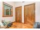 Bedroom with wood floors, large closet, and a sun-filled window overlooking the trees at 1012 King Cir, Chapel Hill, NC 27516