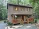 Charming two-story home with a covered front porch, wood siding, and well-maintained landscaping at 1012 King Cir, Chapel Hill, NC 27516