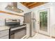 Modern kitchen with stainless steel appliances and access to a deck at 1012 King Cir, Chapel Hill, NC 27516