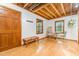 Bright living room with hardwood floors, vaulted ceilings, and natural light from windows at 1012 King Cir, Chapel Hill, NC 27516