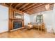 Cozy living room features a fireplace, wood accents, and comfortable leather seating at 1012 King Cir, Chapel Hill, NC 27516