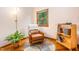 Cozy living room with hardwood floors, a reading chair, and a view of nature through the window at 1012 King Cir, Chapel Hill, NC 27516