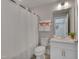 Bathroom with shower featuring white vanity and a large mirror at 10330 Sablewood Dr # 104, Raleigh, NC 27617