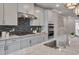 Gourmet kitchen with a gas cooktop, stainless appliances, and granite countertops, perfect for culinary enthusiasts at 10330 Sablewood Dr # 104, Raleigh, NC 27617