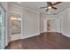 Spacious main bedroom boasts hardwood floors, ensuite bathroom, and access to additional rooms via hallway at 10330 Sablewood Dr # 104, Raleigh, NC 27617