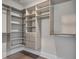 Custom walk-in closet features open shelving and built-in drawers at 10330 Sablewood Dr # 104, Raleigh, NC 27617