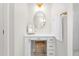 Bathroom featuring a vanity with a makeup mirror, white marble countertop, and wooden stool at 1050 Southern High School Rd, Burlington, NC 27215