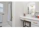 Neutral bathroom featuring a vanity with gold fixtures, make-up mirror and vanity stool at 1050 Southern High School Rd, Burlington, NC 27215