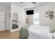 Cozy bedroom with a ceiling fan, stylish decor, comfortable bed, and natural light at 1050 Southern High School Rd, Burlington, NC 27215