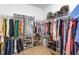 A walk-in closet is filled with racks of clothes, shelves of shoes, and bins of accessories, maximizing storage at 1050 Southern High School Rd, Burlington, NC 27215