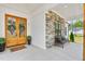 Inviting front porch with stone accents, bench seating, and a welcoming double-door entrance at 1050 Southern High School Rd, Burlington, NC 27215