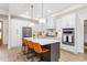Modern kitchen with a large island, stainless steel appliances, and elegant pendant lighting at 1050 Southern High School Rd, Burlington, NC 27215