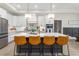 Stunning kitchen boasts a large island, pendant lighting, stainless steel appliances, and white cabinets at 1050 Southern High School Rd, Burlington, NC 27215