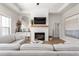 Bright living room featuring a fireplace, wood floors, and stylish neutral decor at 1050 Southern High School Rd, Burlington, NC 27215