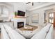 Comfortable living room featuring a fireplace, wood floors, and plush sectional seating at 1050 Southern High School Rd, Burlington, NC 27215