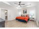 Spacious main bedroom with tray ceiling, fan, and ensuite bathroom, offering a private retreat at 1050 Southern High School Rd, Burlington, NC 27215