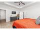 Comfortable main bedroom with tray ceiling, fan, and neutral tones, creating a relaxing atmosphere at 1050 Southern High School Rd, Burlington, NC 27215