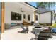 Covered patio with fire pit, outdoor seating, ceiling fans and a built-in grill at 1050 Southern High School Rd, Burlington, NC 27215
