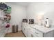 Functional storage area with white cabinets, granite countertops, and open shelving for organization at 1050 Southern High School Rd, Burlington, NC 27215