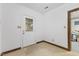 Unfinished basement with a tiled floor, a windowed door, and potential for customization at 106 Autumn Cir, Cary, NC 27518