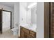 Classic bathroom featuring wooden vanity, toilet, and traditional fixtures at 106 Autumn Cir, Cary, NC 27518