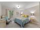 Cozy bedroom with natural light, stylish furniture, and a comfortable bed at 106 Autumn Cir, Cary, NC 27518